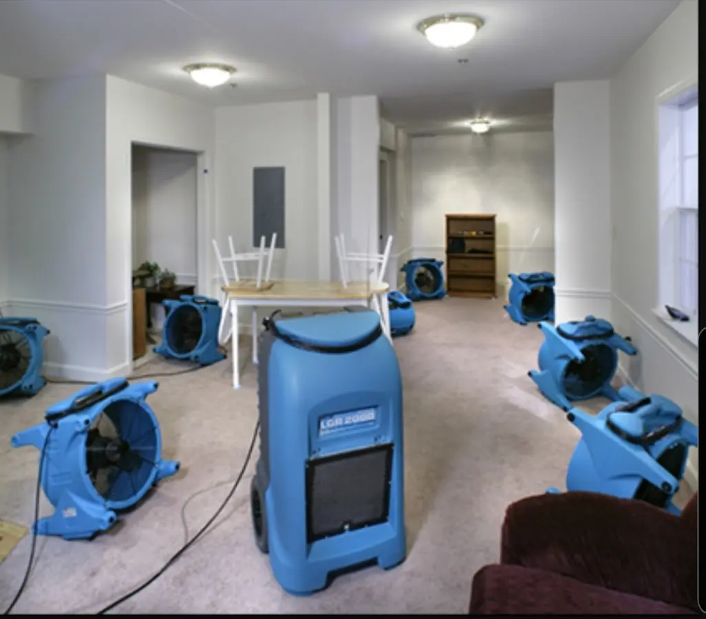 Air movers and dehumidifier setup for Water Damage Restoration in Maysville